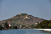 Myanmar - Mandalay hill from the large moat  of the Royal Palace. 